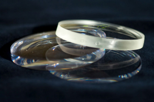 Glass optical lenses stacked
