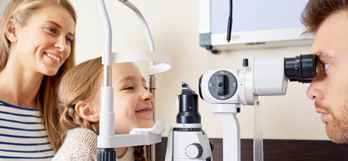Young girl having her eye's examined at an opticians