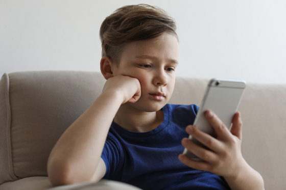 A child looking at a smartphone screen